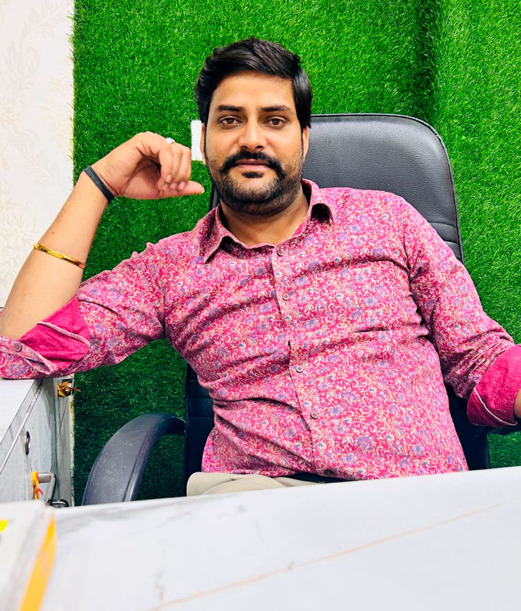 female-patient-shaking-hands-with-doctor-sitting-at-desk-in-office